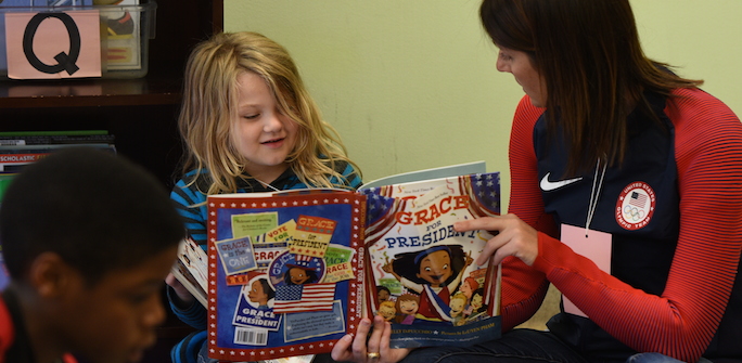volunteer reading at people serving people