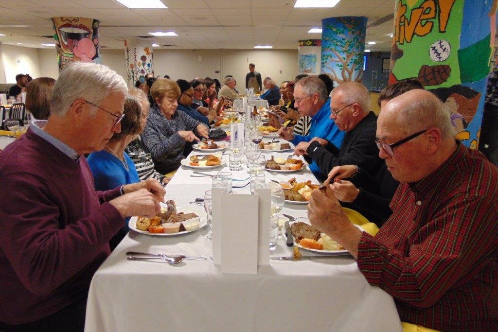 Volunteer Dinner guests dining at tables