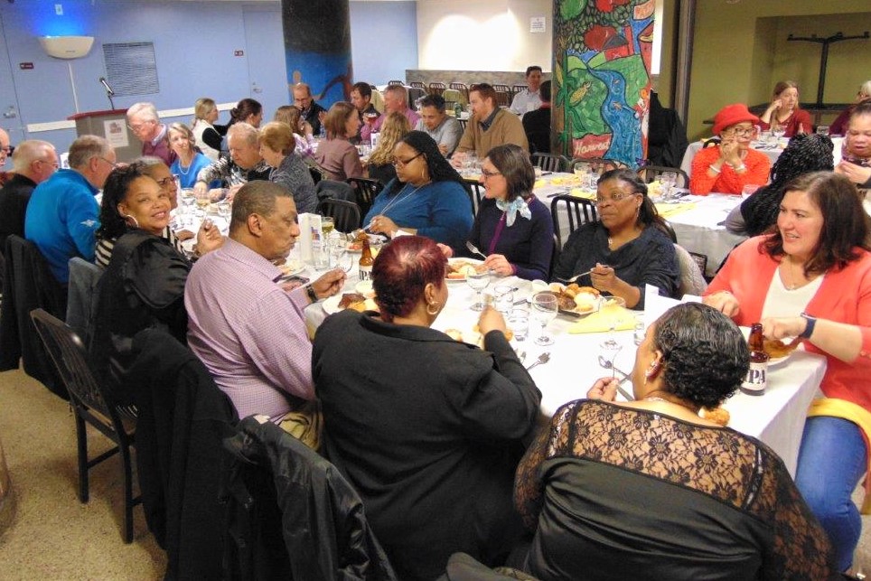 Volunteer Dinner guests dining at tables