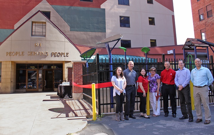 Cummins & People Serving People reps posing prior to ribbon-cutting for playground