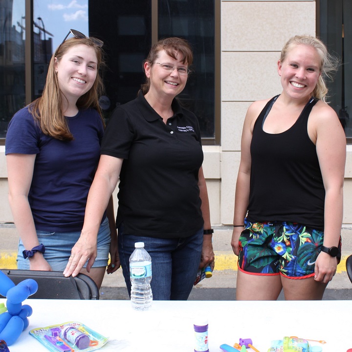 3 women posing at face painting table