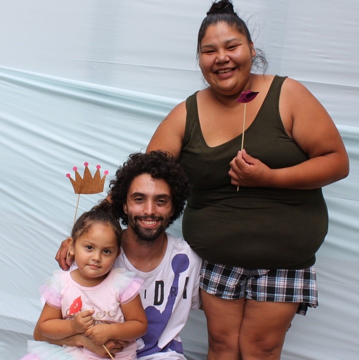 Family posing in photo booth