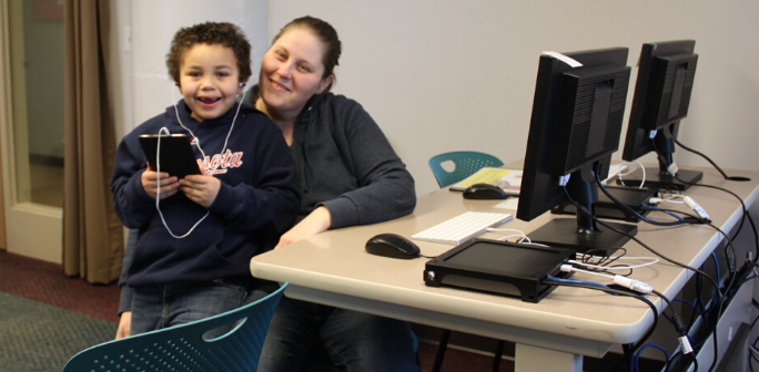 woman & son sitting at computer