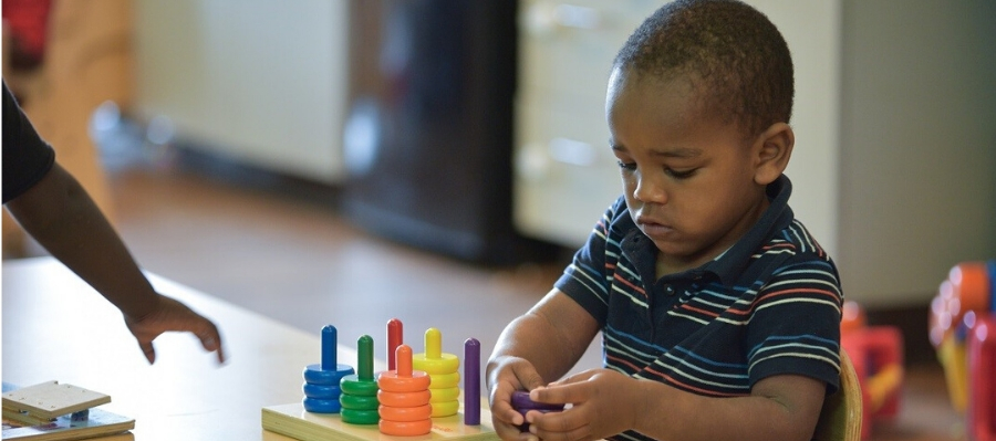 preschool boy stacking rings