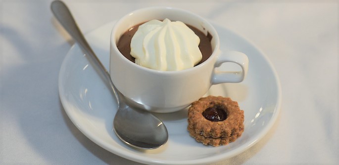 CFC_tablet dessert - cup of chocolate mousse w whipped cream in cup and a small cookie