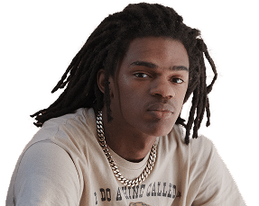 Young man wearing a beige graphic t-shirt looking at the camera.