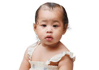A baby with short dark hair wearing a white sleeveless outfit looks forward against a plain background.