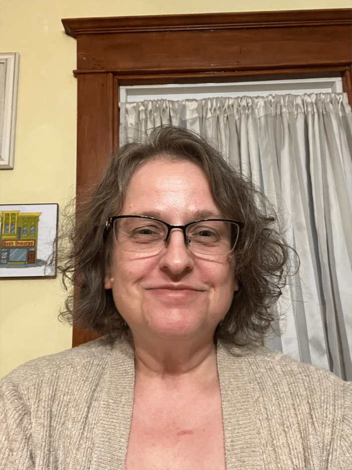 image of woman in glasses volunteer at St Anne's Place