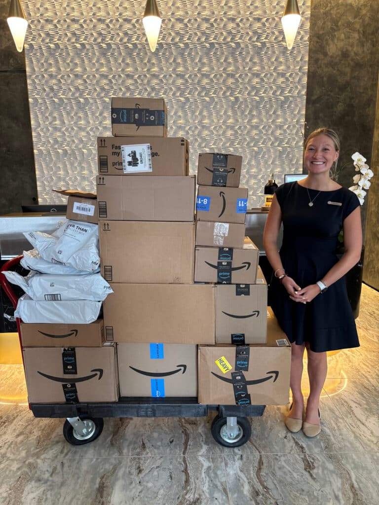 Four Seasons Staff with a large stack of Amazon boxes and packages